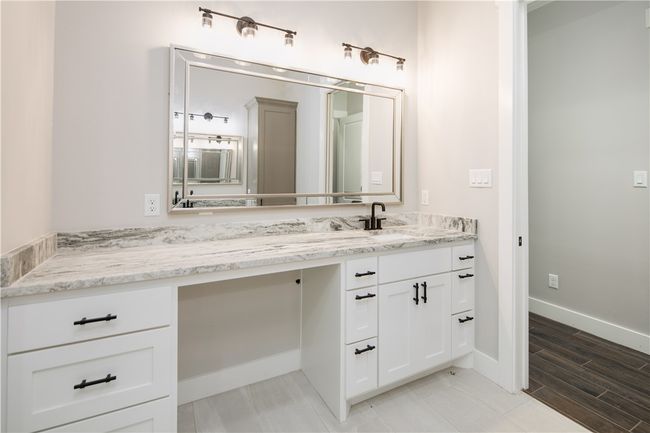 Bathroom featuring vanity and baseboards | Image 15