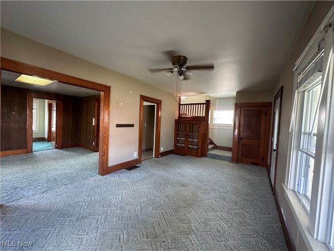 Carpeted spare room with baseboards and a ceiling fan | Image 7
