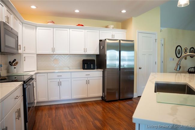 Luxury Vinyl Plank flows throughout home | Image 29
