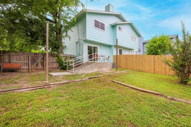 Rear view of house featuring a chimney | Image 27