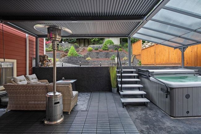 View of patio / terrace featuring a hot tub | Image 32