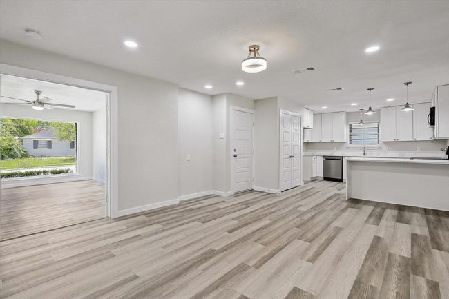 Kitchen featuring visible vents, plenty of natural light, dishwasher, and light countertops | Image 13