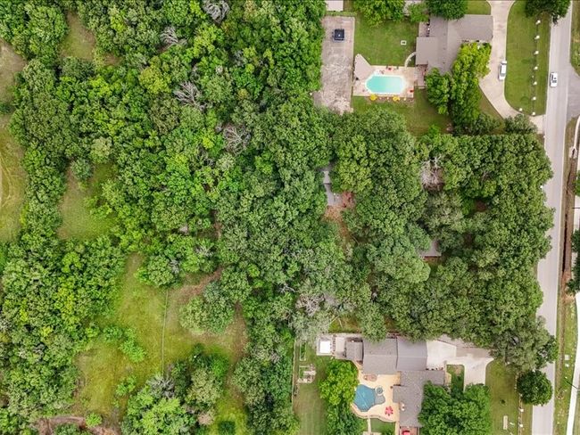 Aerial view of property's location featuring a pool area | Image 15