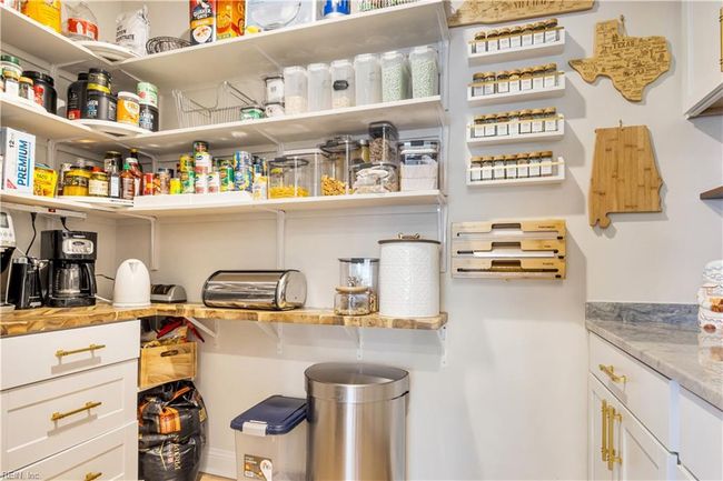 Pantry with custom shelving, cabinetry and coffee bar. | Image 11