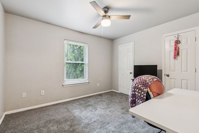 Office space with carpet flooring and ceiling fan | Image 19