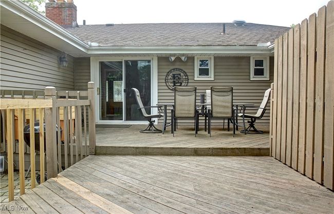 Wooden deck featuring outdoor dining area | Image 38