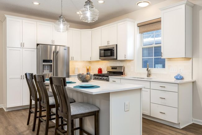 Open concept kitchen with a spacious island. | Image 5