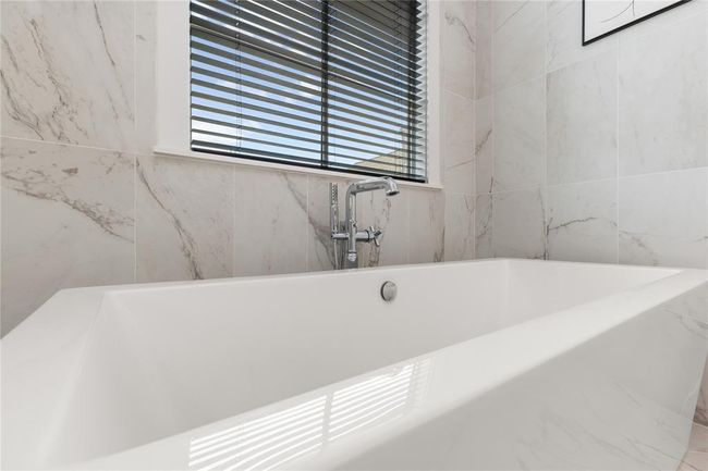 Freestanding soaker tub w/ chrome faucet & hand held attachment for convenience. | Image 37