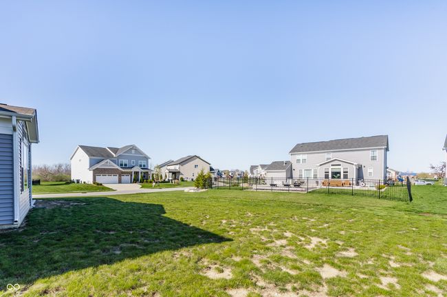 view of yard with fence, a residential view, and a garage | Image 43