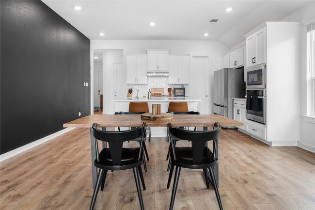 View of dining area and kitchen | Image 7