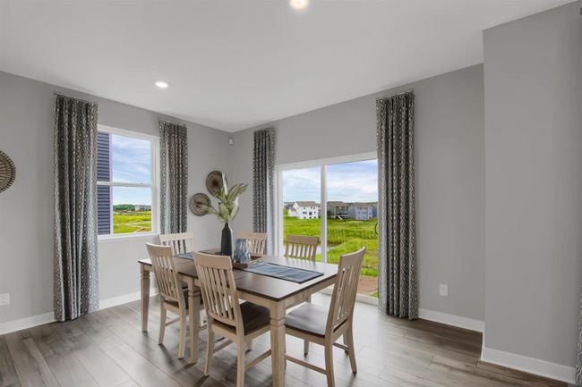Dinette with slider to future deck and backyard. Model photos. | Image 9