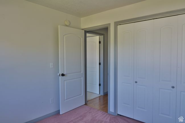 Unfurnished bedroom featuring carpet floors and a closet | Image 33