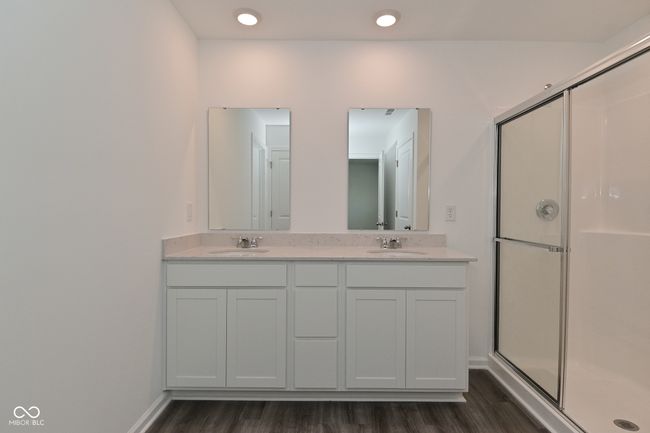 Gorgeous Primary Bathroom, with comfort level height cabinets, quarts counter tops, dual vanity and large shower. | Image 55