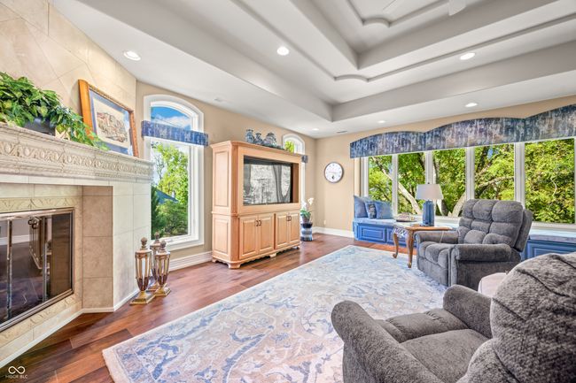 living area featuring recessed lighting, baseboards, a raised ceiling, and dark wood finished floors | Image 20