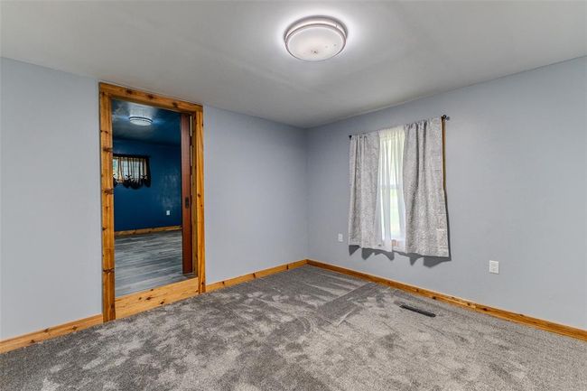 Unfurnished room featuring baseboards and carpet | Image 19