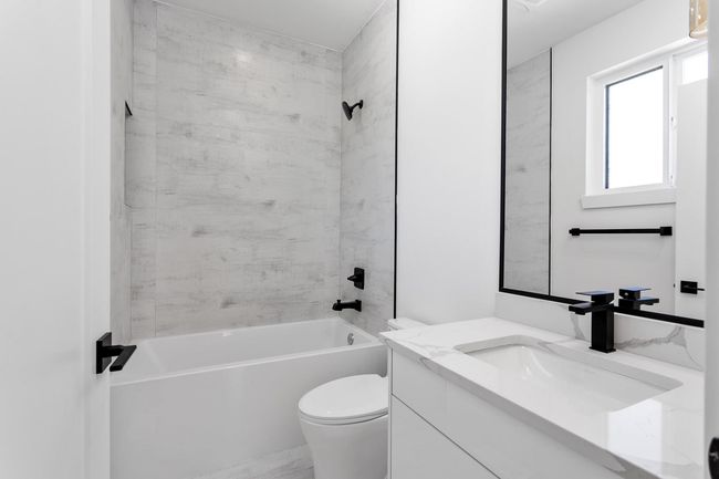 Full bath with shower / washtub combination, toilet, and vanity | Image 24