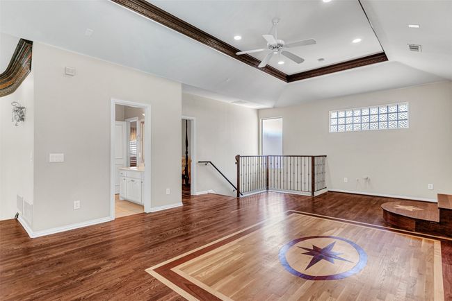 A full bath and third guest bedroom lead to the back staircase that does down to the kitchen - and the wet bar! | Image 30