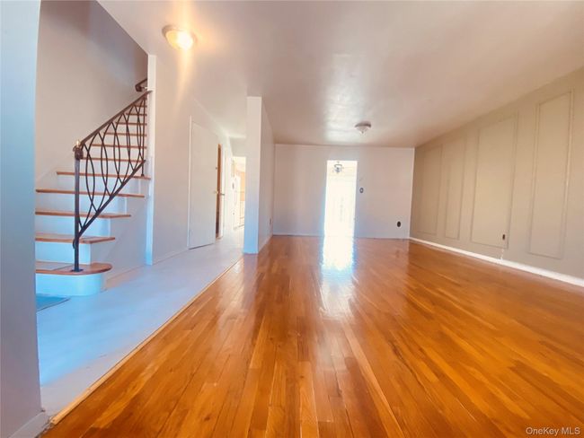 Unfurnished room with hardwood / wood-style floors and baseboards | Image 12