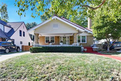 View of front of property with a front yard and covered porch | Image 1