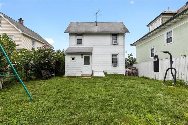 Back of house featuring cooling unit and a yard | Image 21