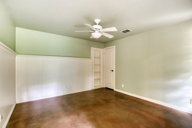 Downstairs bedroom with built-in and closet. | Image 27