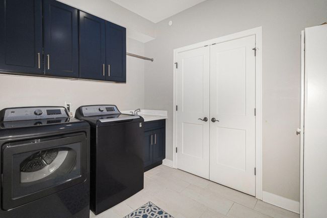 Spacious laundry room with cabinets and laundry sink cabinet | Image 30