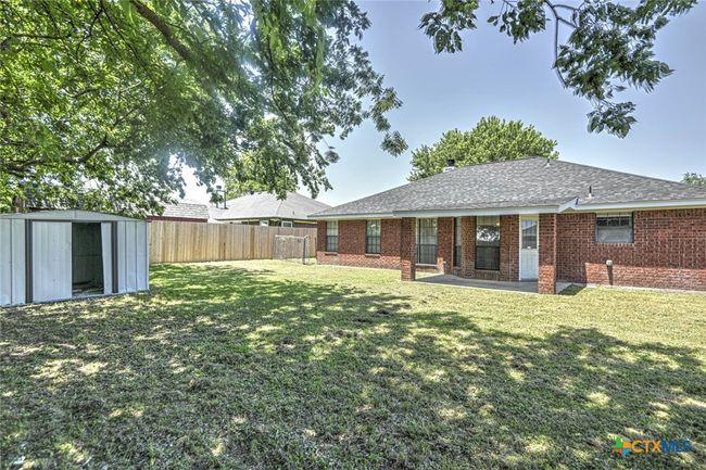 Backyard with storage shed | Image 33