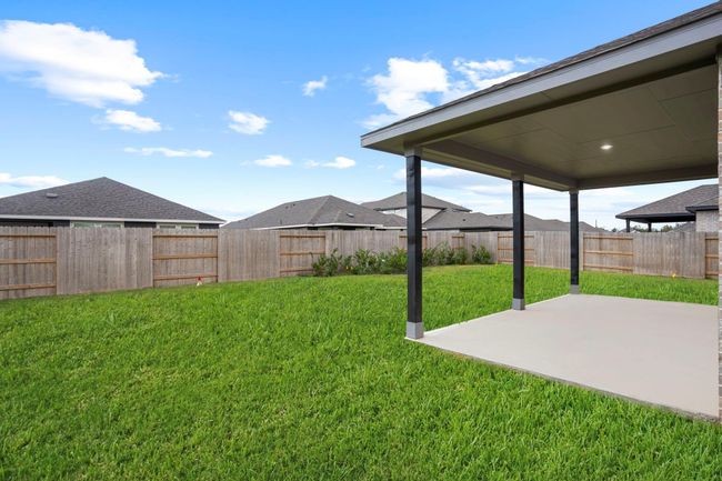 The extended patio provides plenty of space for entertaining family and friends, with room for a grill, outdoor seating, and more. | Image 36
