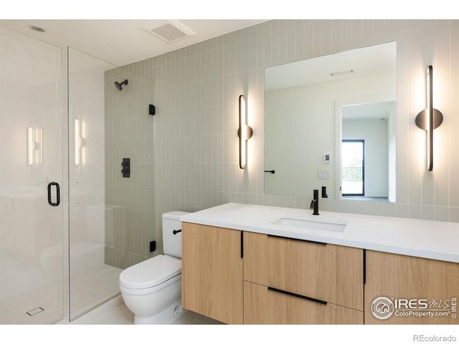 Lower level en-suite bath, radiant heated floors in all bathrooms | Image 31