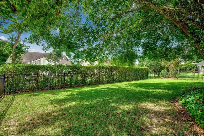 View of fenced backyard | Image 34