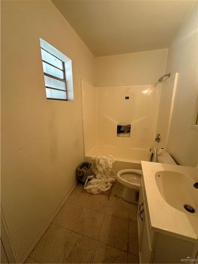 Full bathroom featuring vanity, toilet, shower / tub combination, and tile patterned floors | Image 20