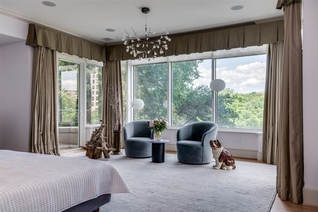 Primary bedroom with sitting area. | Image 13