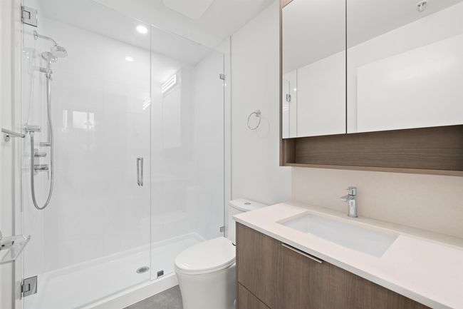 Bathroom featuring vanity and a stall shower | Image 13