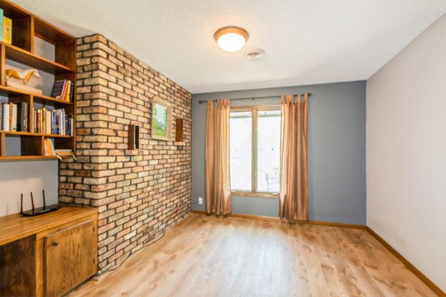 Just off the front foyer is this amazing office space with built in desk and new flooring! | Image 38