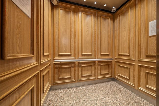 Elevator featuring wood paneling | Image 4