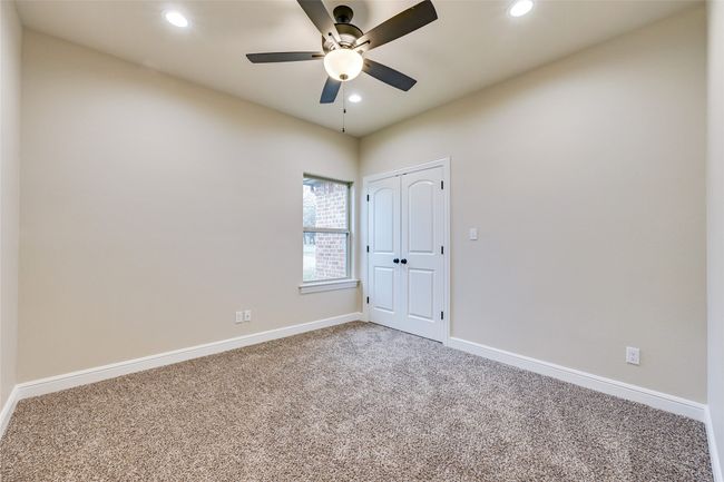 Bedroom room featuring carpet, ceiling fan, recessed lighting and baseboards | Image 12