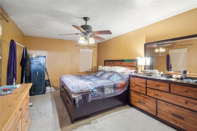 Bedroom with light colored carpet | Image 17