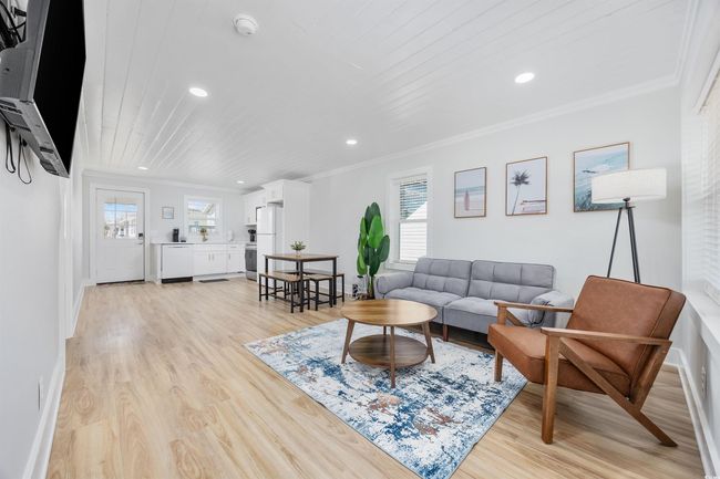Living room featuring recessed lighting, ornamental molding, light wood finished floors, and baseboards | Image 17