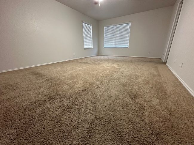 Carpeted spare room featuring baseboards | Image 29