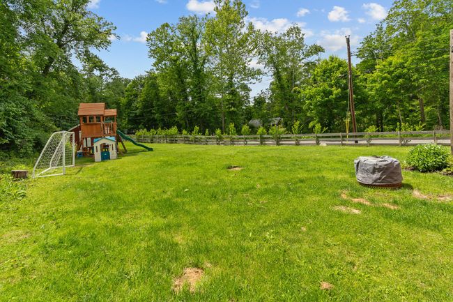 View of yard featuring a playground | Image 8