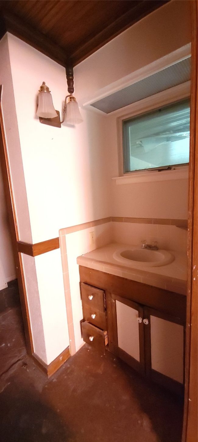 Bathroom featuring vanity and wooden ceiling | Image 22