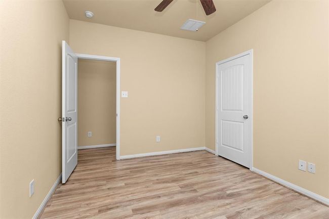 An alternate view of the first secondary bedroom highlights its versatility—perfect for family members, guests, or even a home office. | Image 18