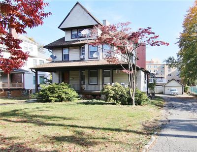 Featuring a front Yard and detached Garage | Image 2