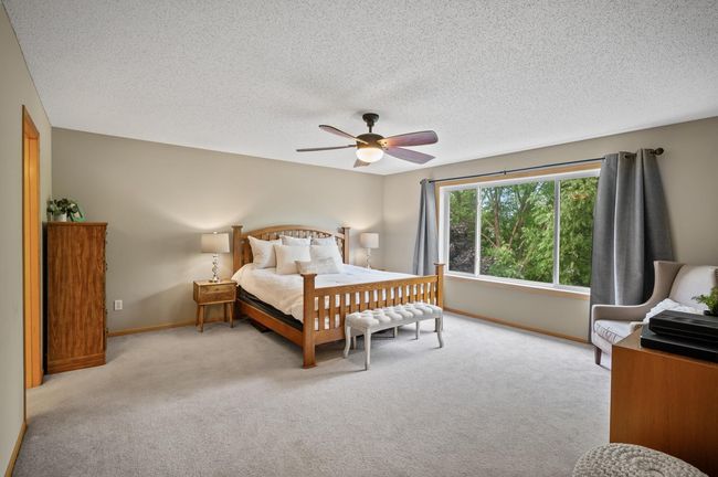 Huge owners suite, with private bath, overlooks the back yard. | Image 19