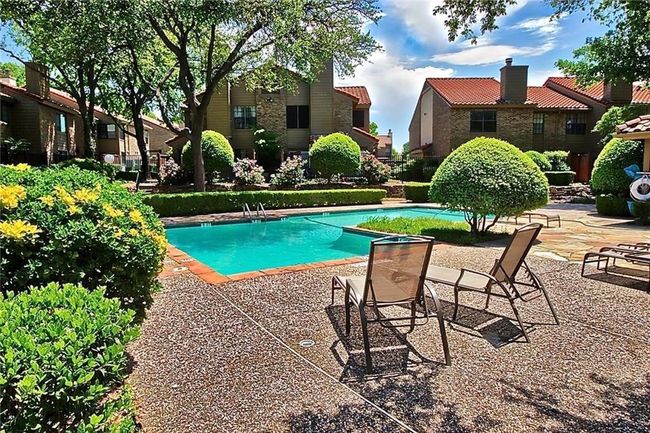 Community pool featuring a patio area and a residential view | Image 17