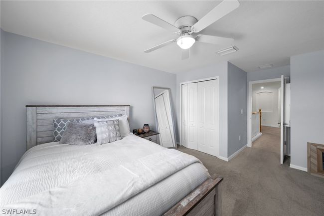 Bedroom featuring carpet, a closet, and ceiling fan | Image 33