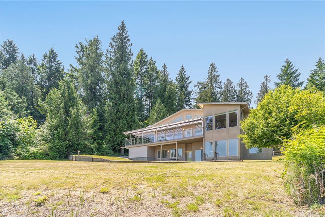 Back of property featuring a yard, a deck, and stucco siding | Image 66