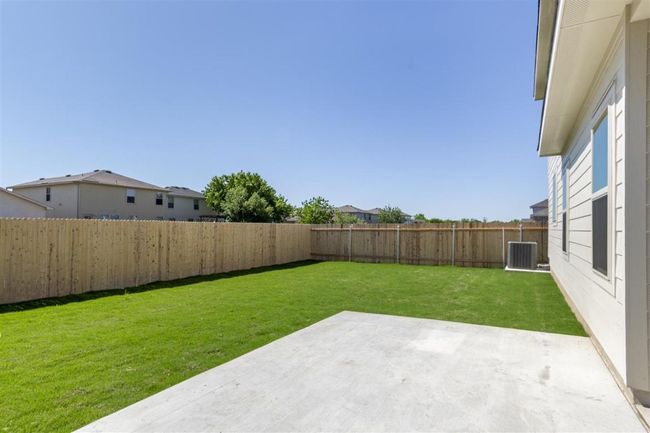 View of yard with a patio area, a fenced backyard, and central AC unit | Image 30