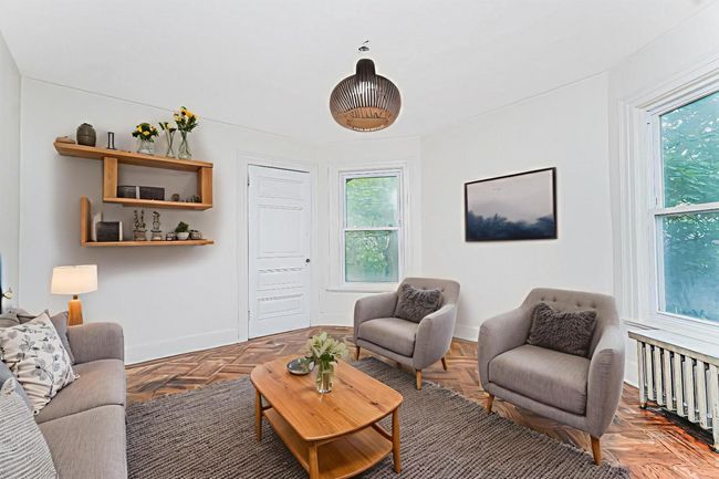Living room with baseboards | Image 13