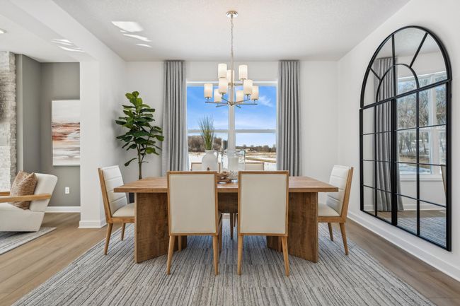 Photo is of the actual model. This formal dining area is large enough to comfortably accommodate a 10-seat dining room table. | Image 11